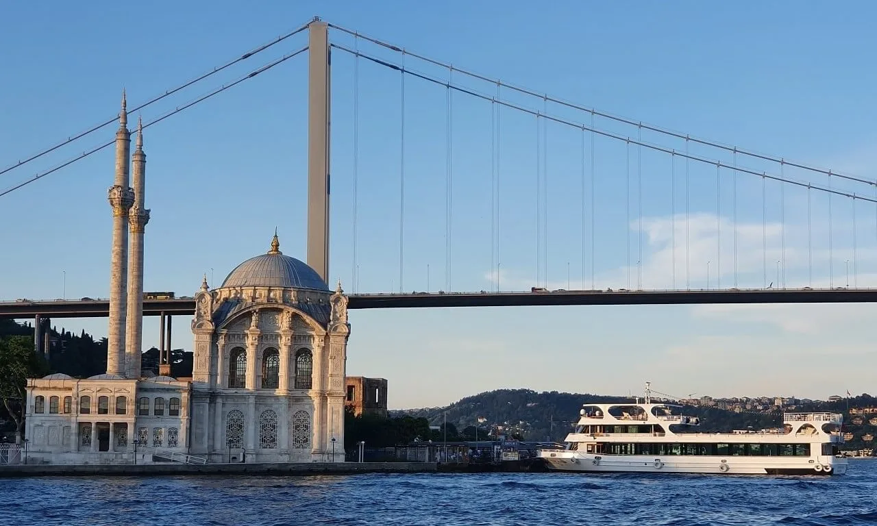 boat cruising on the Bosphorus with a view of the Ortakoy Mosque