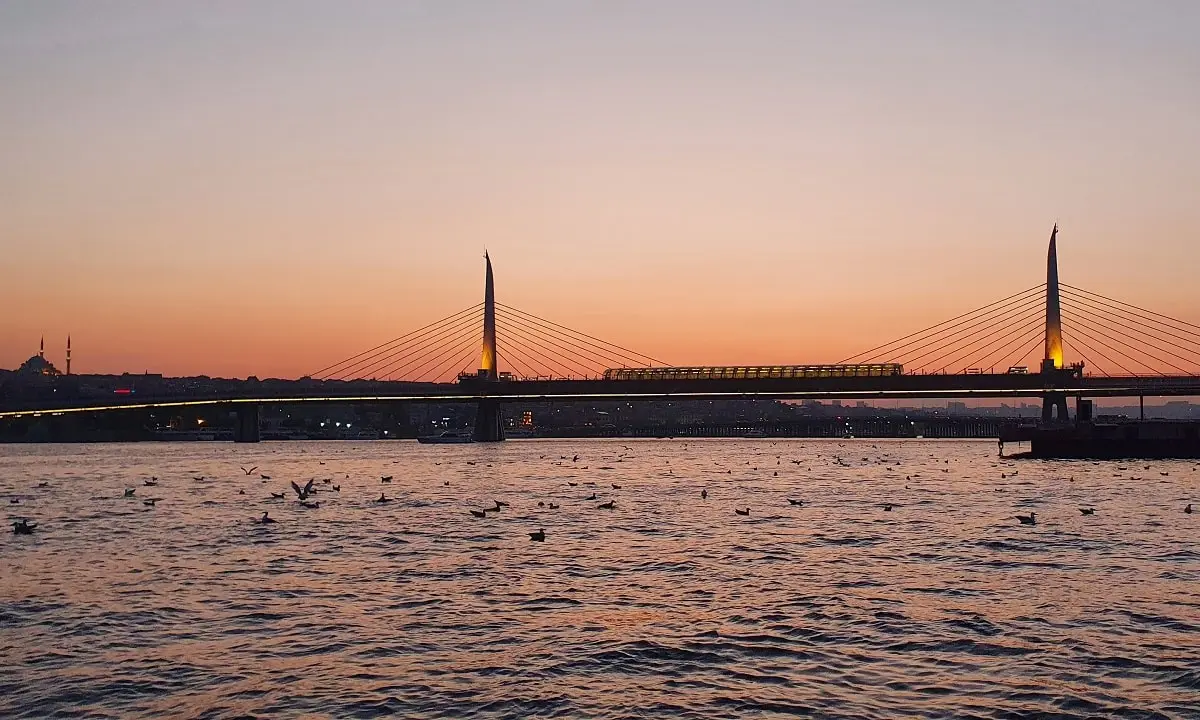 Golden Horn Metro Bridge and Istanbul view at sunset