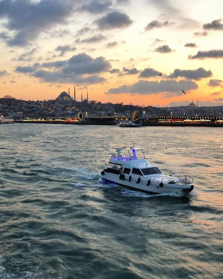 A luxury yacht cruising in the sunset on the Bosphorus in Istanbul